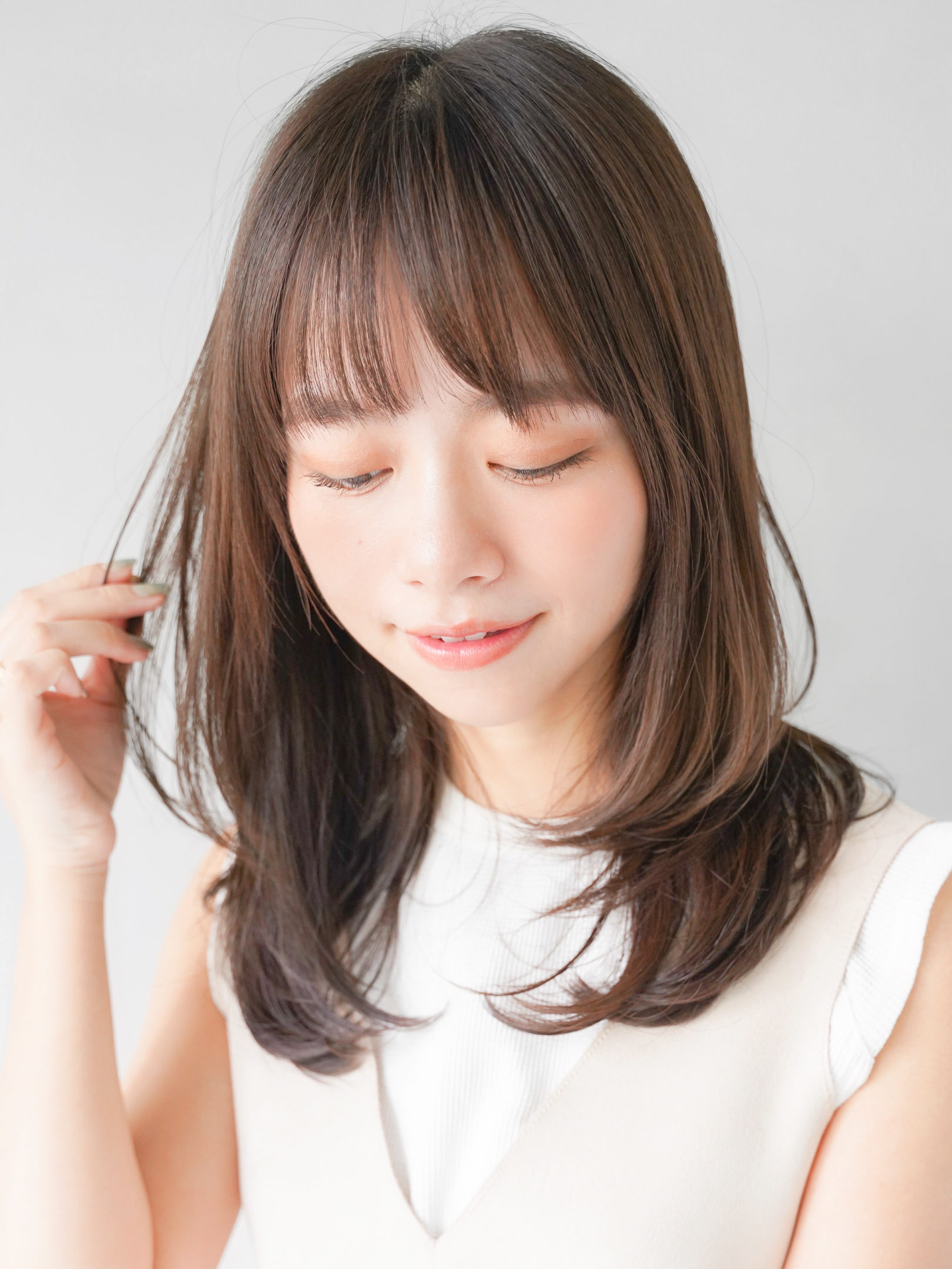 レイヤースタイルで軽さのある柔かい髪型に 表参道 青山の美容院 美容室グループ Kanow Group